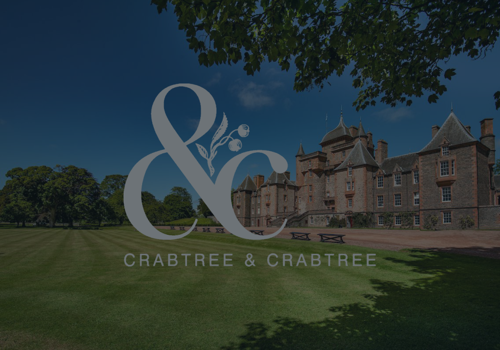 Crabtree & Crabtree logo layered over an image of on of their properties, a large, stately building.