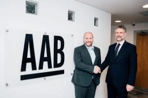 Graeme Allan and Graeme Finnie shaking hands to confirm AAB Group Largest Acqusition